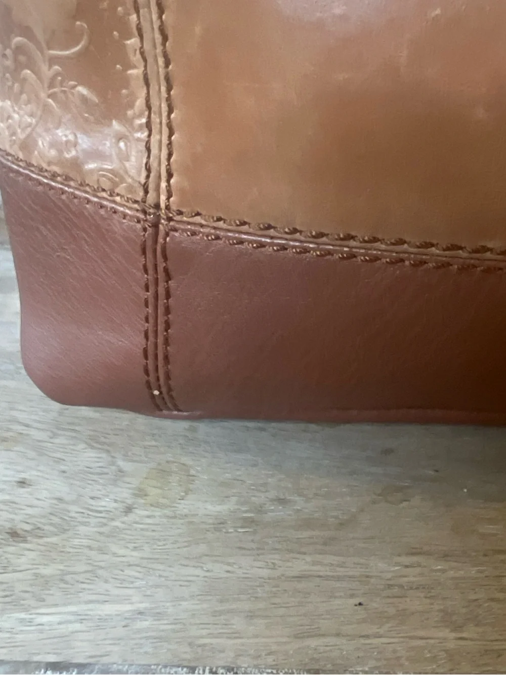 The Sak tan leather crossbody with beige interior